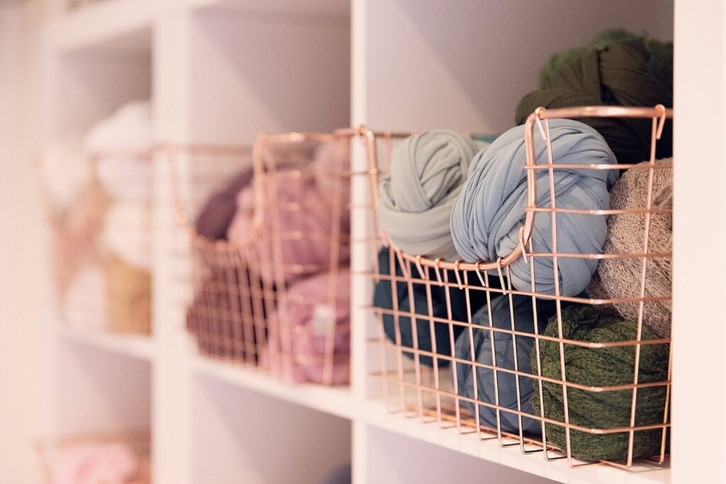 Organized newborn wraps and styling materials inside the Oakville newborn photography studio at McLelland Photography. 