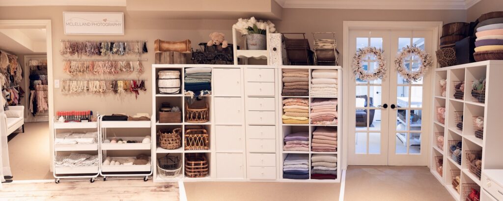 Fully stocked Oakville newborn photography studio with wraps, props, and styling accessories at McLelland Photography. 