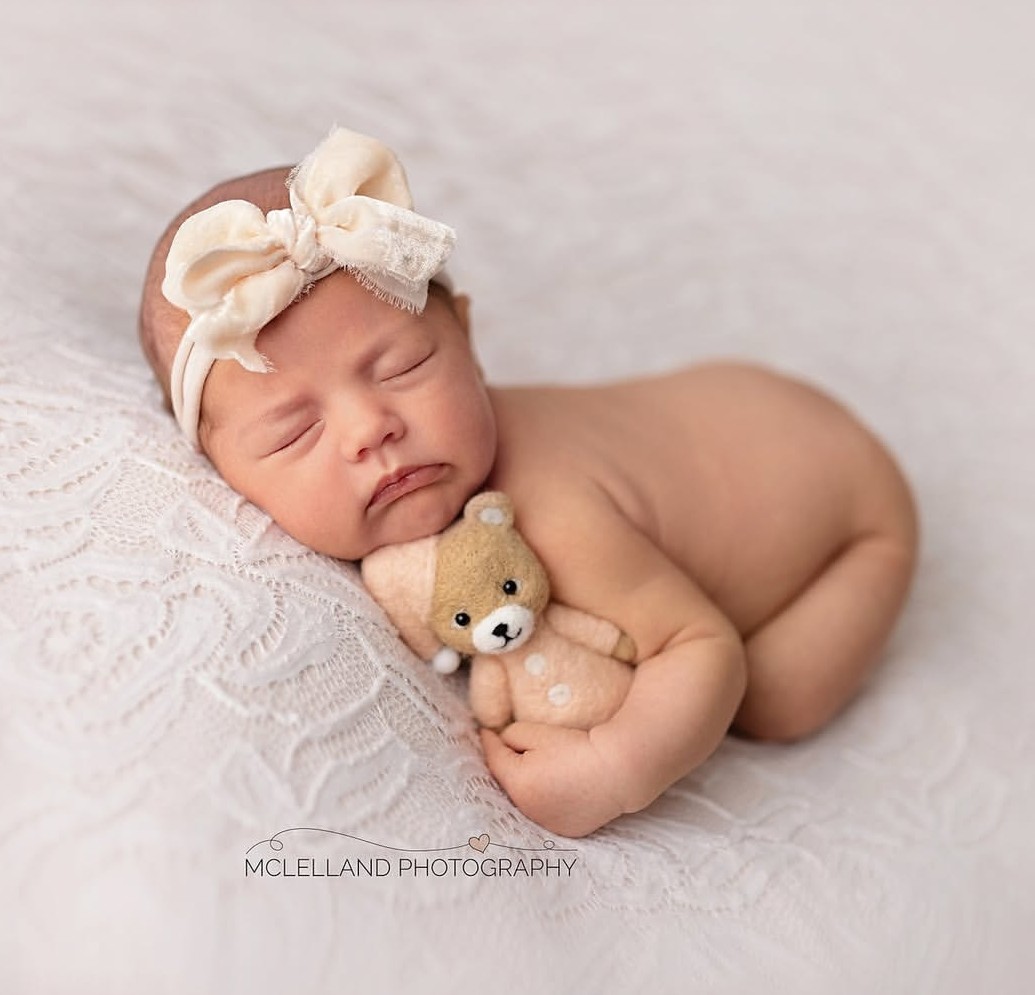 newborn photography safety training in action during a newborn photo shoot