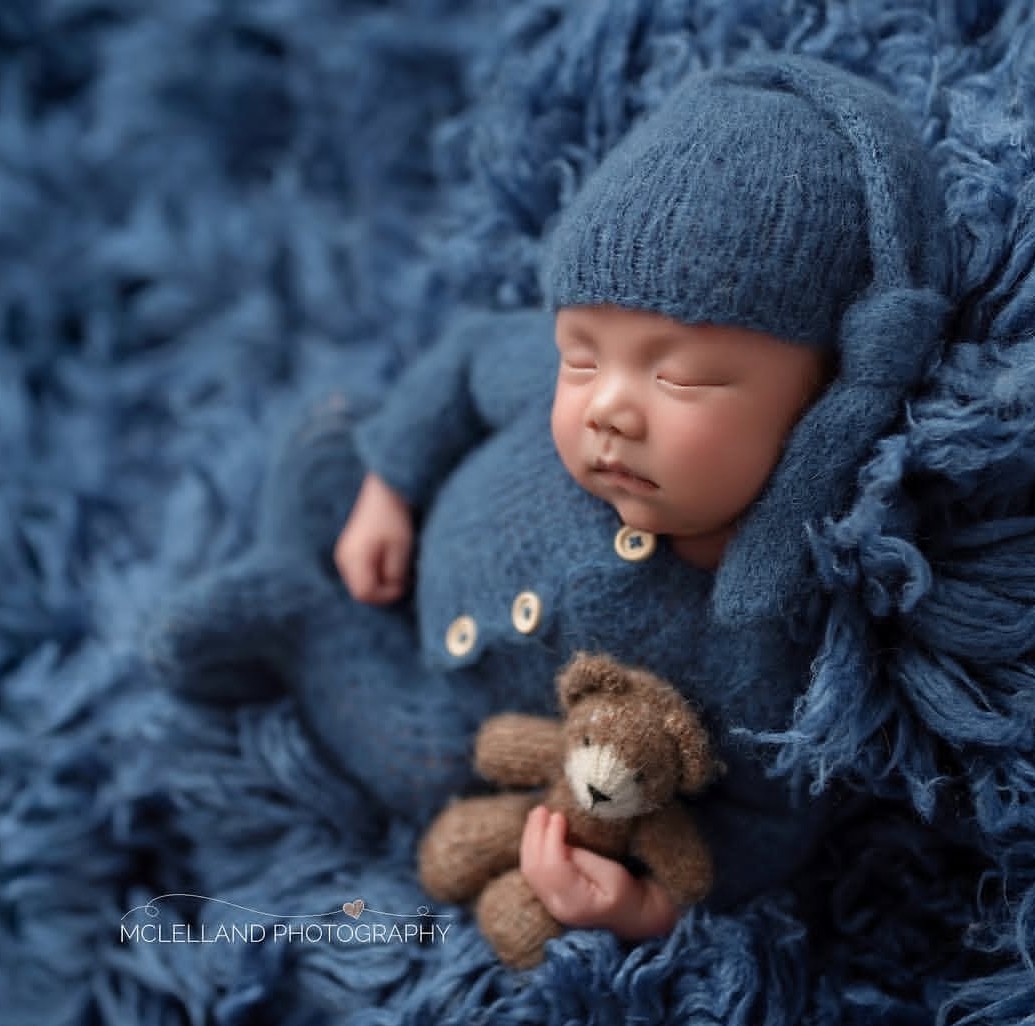 after completing a newborn safety training course, mclelland photography captured a sweet newborn image