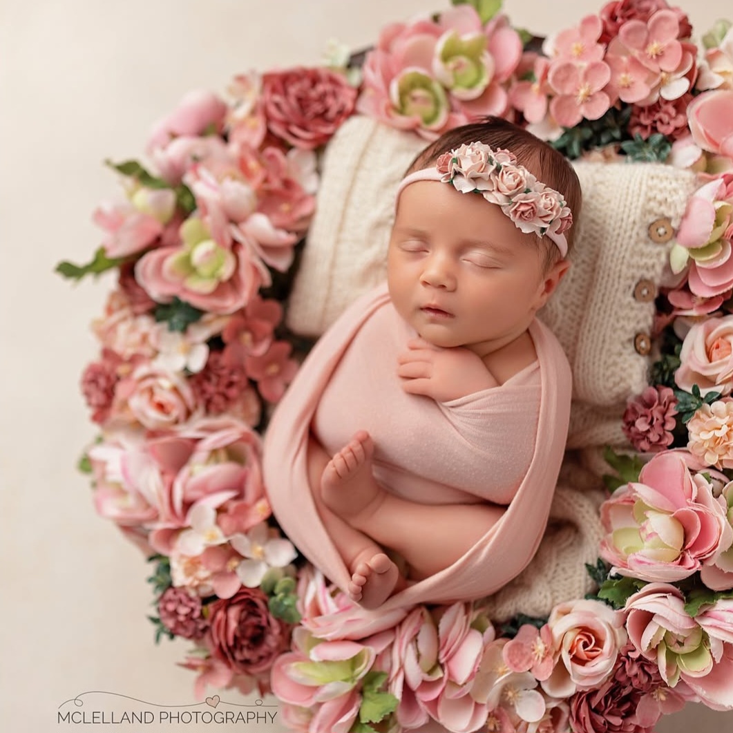 portrait of a newborn taken because their parents asked when to schedule newborn photos and made the booking